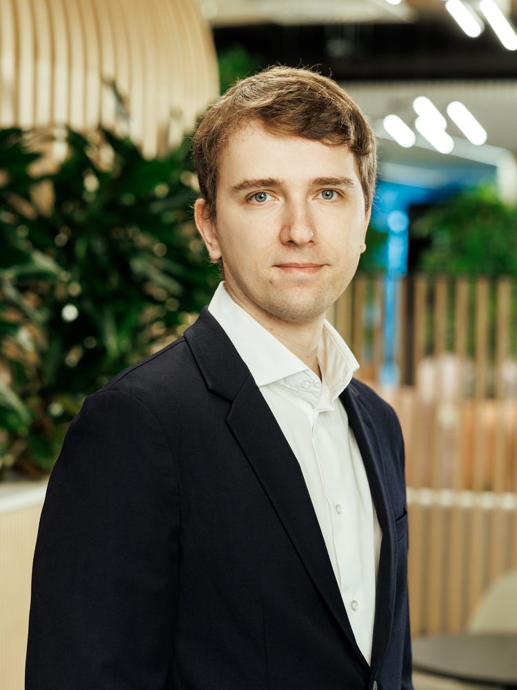 Portrait of Raivis Kalnins in a modern office lounge